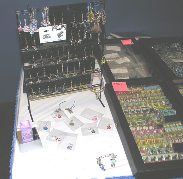 DogCatCreations table at show with dog earrings and charms